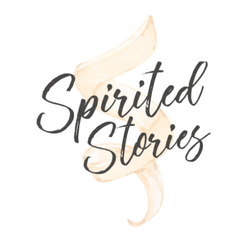 Spirited Stories displayed in a handwritten font, with a faint orange peel behind the text.